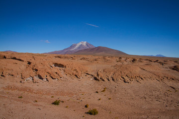 Desert and mountain over blue sky and white clouds on Altiplano,Bolivia Chile 