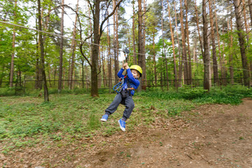 Little boy in climbing gear