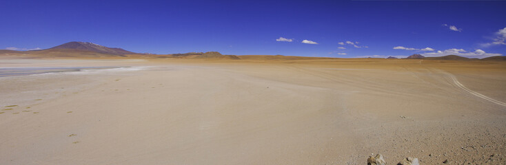 Desert and mountain over blue sky and white clouds on Altiplano,Bolivia Chile 