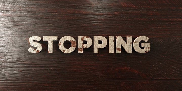Stopping - grungy wooden headline on Maple  - 3D rendered royalty free stock image. This image can be used for an online website banner ad or a print postcard.