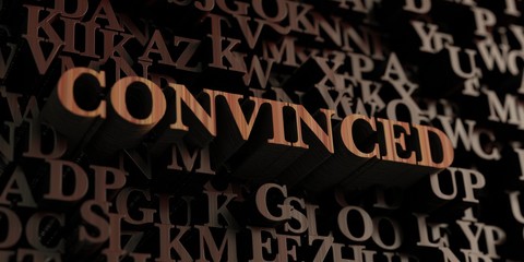 Convinced - Wooden 3D rendered letters/message.  Can be used for an online banner ad or a print postcard.