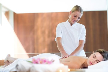 Woman receiving a back massage