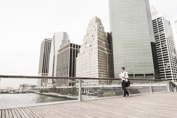 USA, New York, Businesswoman walking in Manhattan