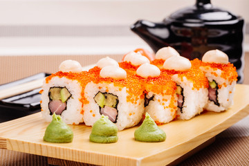 Maki Sushi made of Salmon, Red caviar, cucumber, avocado