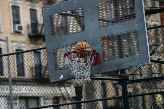 Basket-ball thrown into a basket