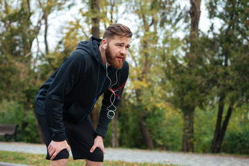 Fototapeta premium Tired runner in park