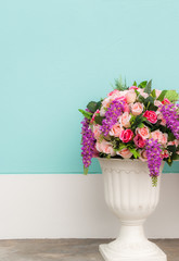 colorful of rose in flowerpot pastel wall background