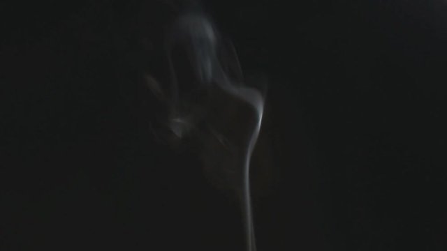 White Smoke on black background in some parts slow motion 