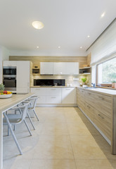 Fototapeta premium Modern kitchen filled with freshness and air