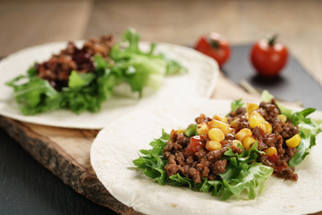 open tortilla with beef, frillice and corn, organic fastfood