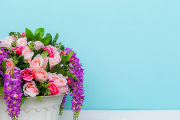 colorful of rose in flowerpot pastel wall background