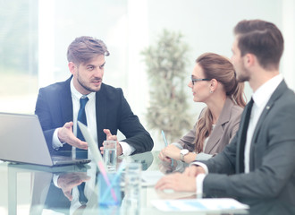 Business meeting at the table with computer