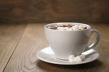 cup of homemade hot chocolate with marshmallows, shallow focus