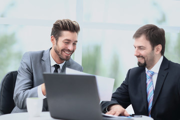 Business men discussing together in an office