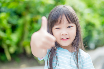 girl smile happily in park
