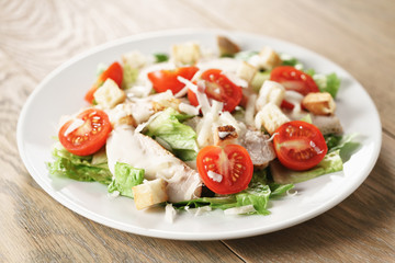 caesar salad with red cherry tomatoes, shallow focus