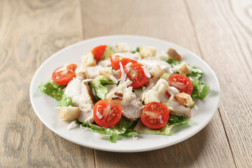 caesar salad with red cherry tomatoes, shallow focus