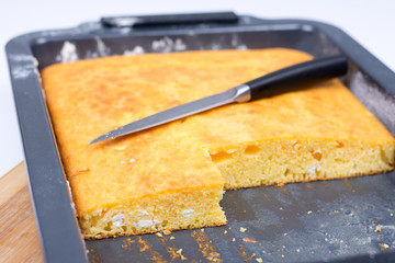 Cornbread baked in oven with cutting knife