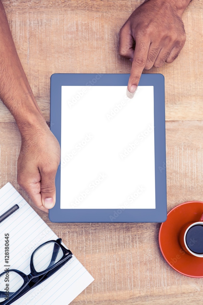 Poster Overhead view of person using on digital tablet
