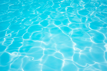 Fototapeta na wymiar Beautiful ripple water surface with sun reflection in swimming p