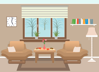 Living room interior including furniture, winter landscape in window and books.