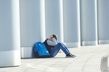 schoolboy crying on the street