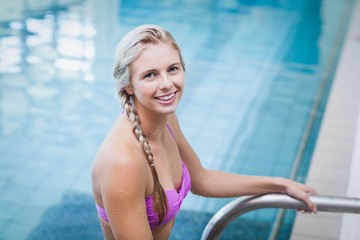 Pretty woman getting out of the water