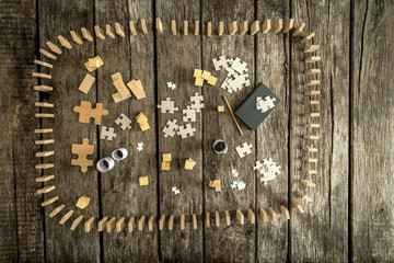 Puzzle pieces, blocks, cubes, notepad, pencil and dominos
