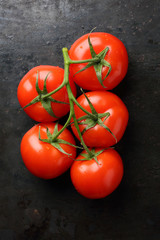 Branch of fresh red tomatoes