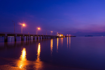 Fototapeta na wymiar twilight landscape of pier on the sea.at sattahip beach,Chonburi,Thailand.