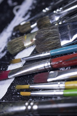 Obraz premium paint brush on grungy black and white acrylic paint canvas