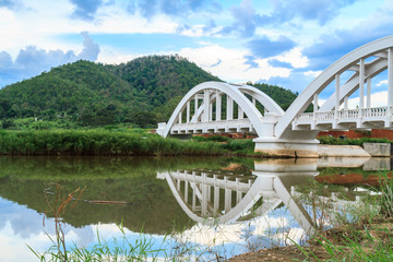 Fototapeta na wymiar White bridge backdrop blue sky at mae tha, Lamphun, Thailand.