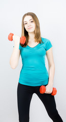 girl with dumpbells on white background sport concept gym