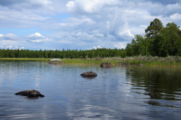 Hude boulders in nothern Karelian lake © serg269