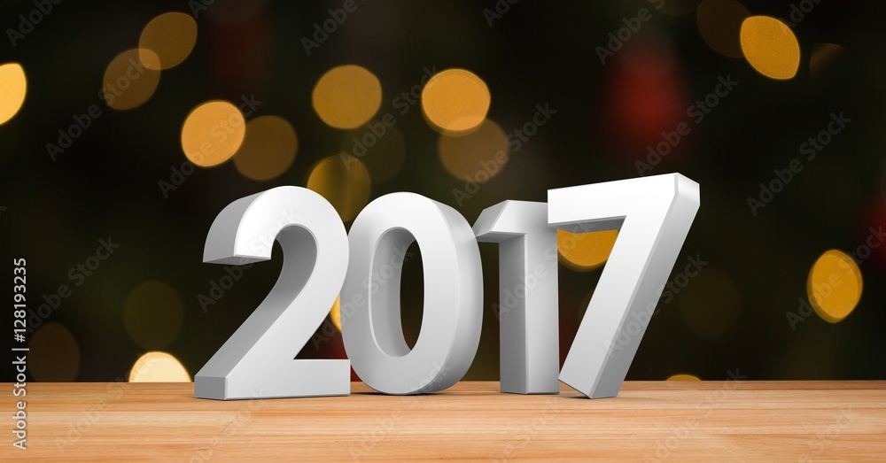 Poster 2017 on wooden plank against a composite image 3D of bokeh light