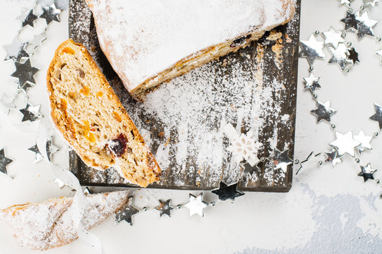 Christmas stollen over festive background. Selective focus