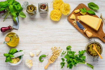 Fototapeta na wymiar Pesto with Cheese and Cooking Ingredients on Copy Space Frame