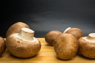 mushroom champignons on a wooden Board