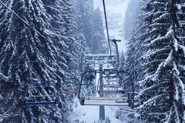 Ski lift in the forest - 128196056