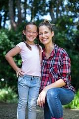 Obraz premium Portrait of happy girl standing by mother