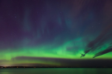 Northern lights over lake in finland