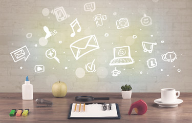 Office desk with communication icons