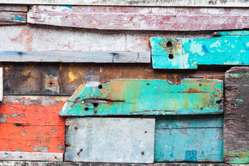 Wood material background for old Vintage wallpaper for background,exposed wooden wall exterior, patchwork of raw wood forming a beautiful parquet wood pattern