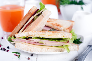 breakfast with club sandwich and juice