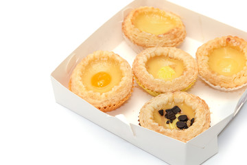 delicious portuguese egg tart on white box with copy space