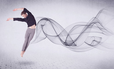 Naklejka na ściany i meble Modern ballet dancer performing with abstract swirl