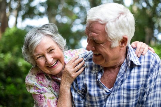 Senior couple enjoying in back yard