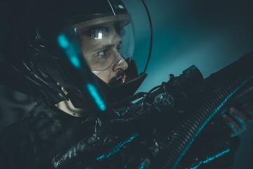 Fantasy and science fiction scene, space man with metallic helme