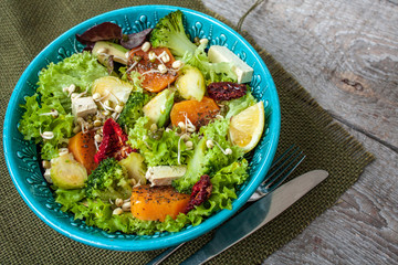 Salad with sweet potatoes, dried tomatoes, avocado, broccoli, brussels sprouts, tofu, mung bean sprouts. Perfect for the detox diet or just a healthy meal.  Love for a healthy raw food concept.
