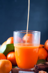 Healthy mandarin juice on wooden table